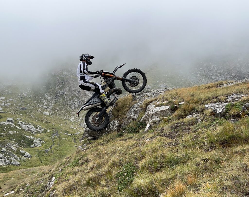 Tackling a big boulder with my enduro bike