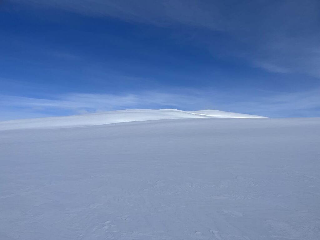 Sky and snow, somewhere up north.